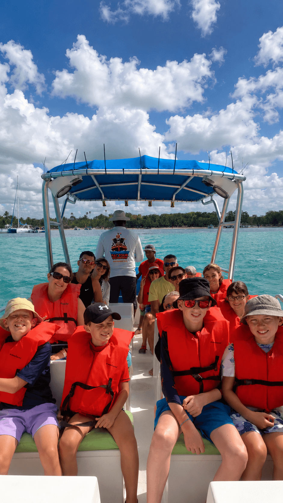Family wearing life jackets on the Pac Tour boat
