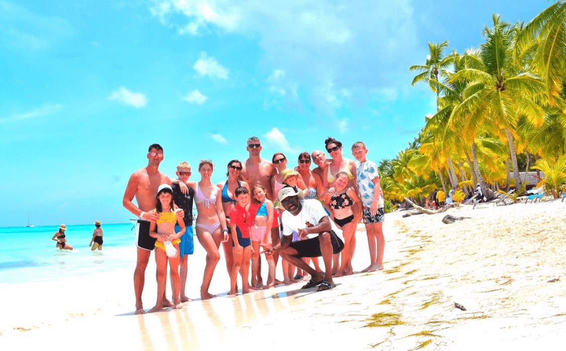 Large family group with the Pac Tour team on a Saona Island beach